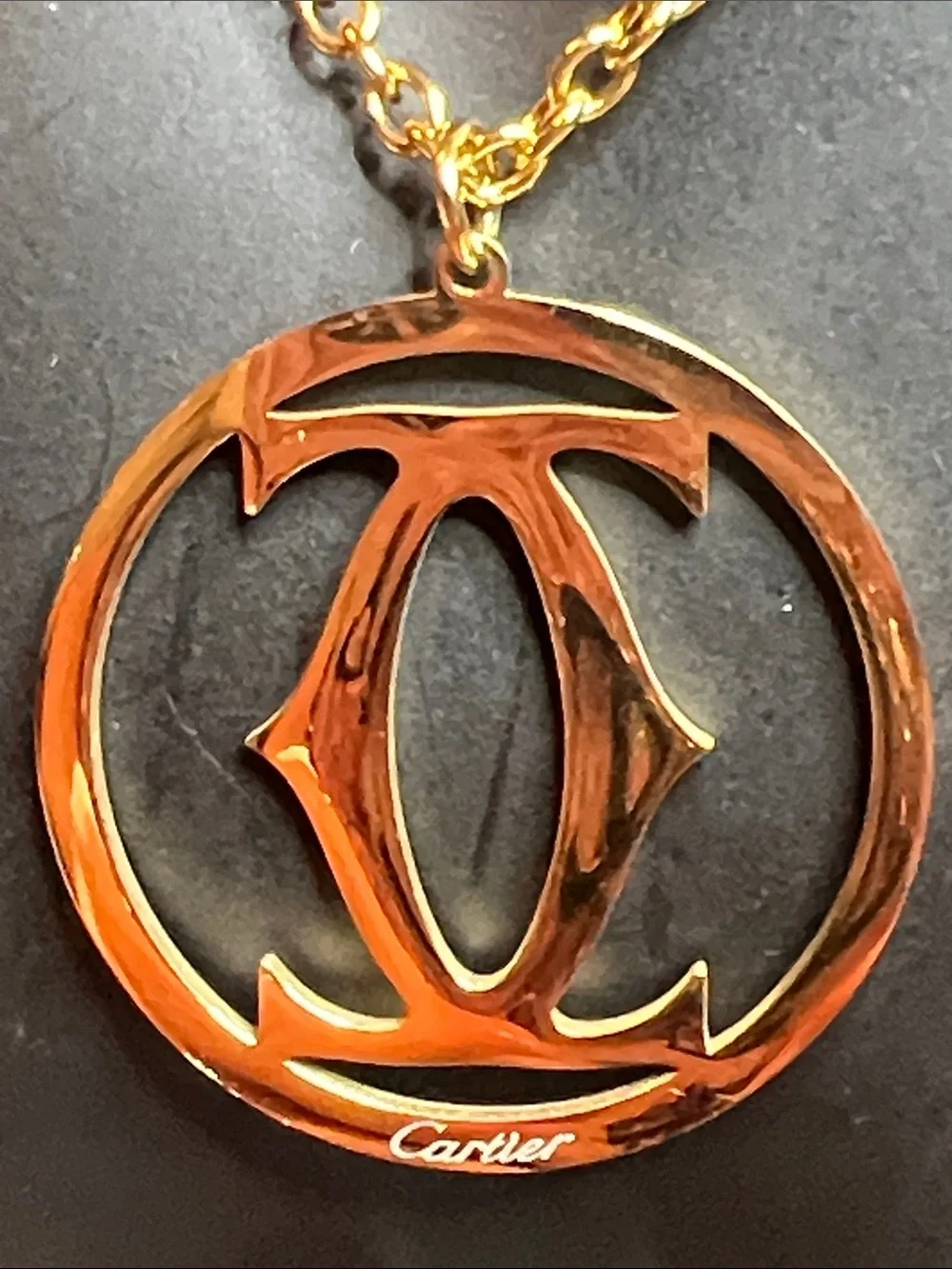 Gold and Black Circular Logo Pendant Necklace